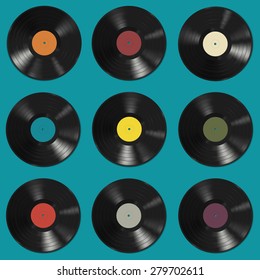 Vinyl records with colorful labels on blue background. Seamless pattern.