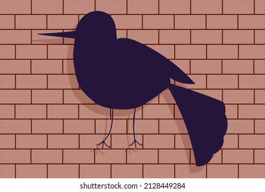 Violet bird on brick wall. Dark silhouette with shade. Little bird.