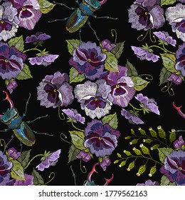 Violet flowers and meadow herbs. Embroidery. Seamless pattern. Botanical background. Summer garden art. Fashion template for clothes, textiles
