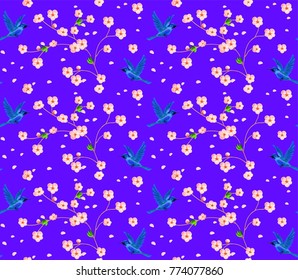 Violet seamless pattern with Japanese blue bird and blossom sakura flowers.