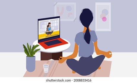 virtual yoga classes by looking at a computer screen. Online tutorial in pandemic era to stay at home