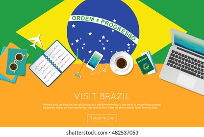 Visit Brazil concept for your web banner or print materials. Top view of a laptop, sunglasses and coffee cup on Brazil national flag. Flat style travel planninng website header.