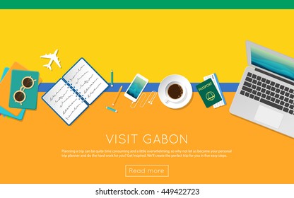 Visit Gabon concept for your web banner or print materials. Top view of a laptop, sunglasses and coffee cup on Gabon national flag. Flat style travel planninng website header.