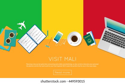 Visit Mali concept for your web banner or print materials. Top view of a laptop, sunglasses and coffee cup on Mali national flag. Flat style travel planninng website header.