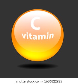 
Vitamin C. A yellow capsule on a gray background.