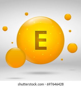 Vitamin E gold icon. tocopherols drop pill capsule. Vitamin complex design