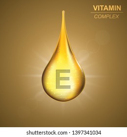 Vitamin E gold shining drop icon .Tocopherol Vitamin complex background