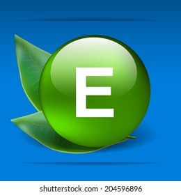 Vitamin E with green leaves as concept