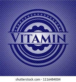 Vitamin emblem with jean background