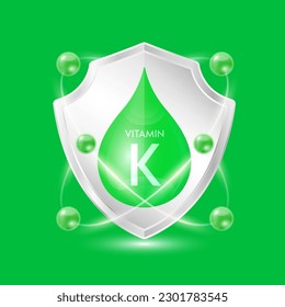 Vitamin K green drop inside aluminum shield with atom surround. Minerals and vitamins complex protect the body stay healthy. For nutrition products food. Vector EPS10 illustration.