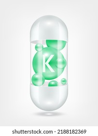 Vitamin K green inside capsule pill transparent white. Health care beauty enhancement neutralize free radicals. Used for nutrition products food template design. 3D Realistic Vector EPS10.