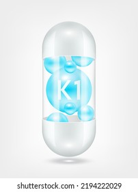 Vitamin K1 blue inside capsule pill transparent white. Health care beauty enhancement neutralize free radicals. Used for nutrition products food template design. 3D Realistic Vector EPS10.