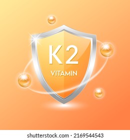 Vitamin K2 shield with orange atom. Protect the body stay healthy. For nutrition products food. Medical scientific concepts. Vector illustration.