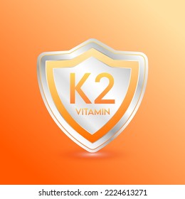 Vitamin K2 shield orange. Protect the body stay healthy. For nutrition products food. Metal aluminum label 3d isolated realistic on solid background. Medical scientific concepts. Vector illustration.