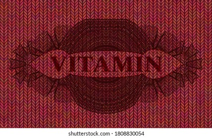 Vitamin text inside Guilloche Red woolen fabric badge. Cloth fashionable background. Intense illustration. 