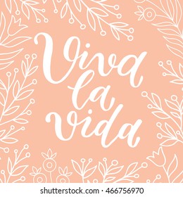 "viva la vida" hurray for life ink lettering poster with floral branches on a cream background. Calligraphy poster, postcard, print.