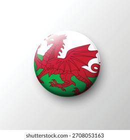 A vivid 3D button of the Wales flag showcasing the iconic red dragon above a white and green background.