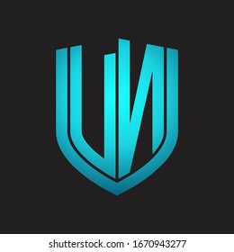 VN Logo monogram with emblem shield design isolated with blue colors on black background