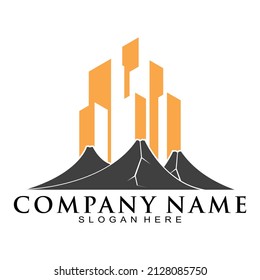 Logo del vector del volcán y del edificio de la ciudad