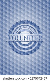 Volunteer blue badge with geometric pattern background.