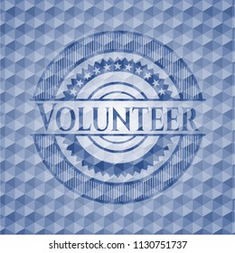 Volunteer blue emblem or badge with abstract geometric pattern background.