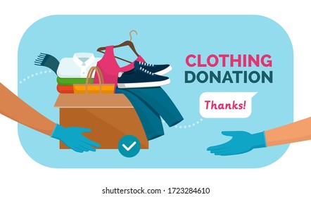 Volunteer holding a donation box with clothing and using protective gloves, covid-19 solidarity response and volunteering concept