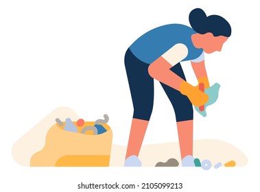Volunteer woman collect garbage in plastic trash bag