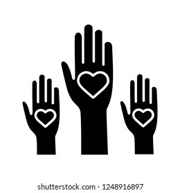 Volunteering experience glyph icon. Volunteers. Helping hands. Voting. Charity. Unity in diversity. Silhouette symbol. Negative space. Vector isolated illustration