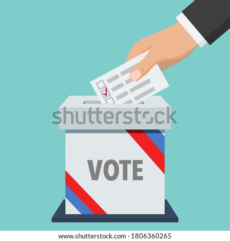 Voter hand putting voting paper into ballot box