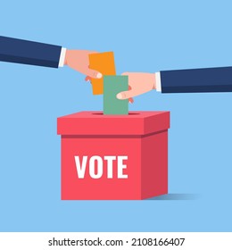 Voting and election, hand holding the ballot paper into the ballot box