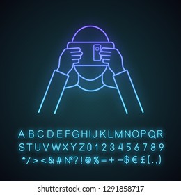 VR cardboard neon light icon. Virtual reality platform. Hand made VR headset with smartphone. Virtual reality player. Glowing sign with alphabet, numbers and symbols. Vector isolated illustration