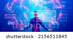 VR technology in industry. Man in VR glasses in virtual reality looking at projection of HUD holographic interface. Futuristic scientist working in Augmented reality or AR headset in cyberspace.