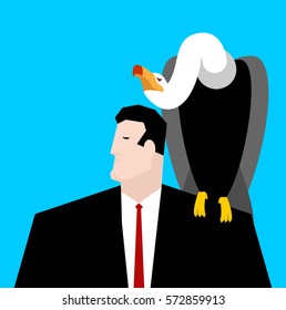 vulture and businessman. neophron sitting on man shoulder

