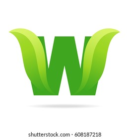 W icon with green leaves. Vector eco design.