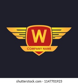 W initial shield with wings gold color logo