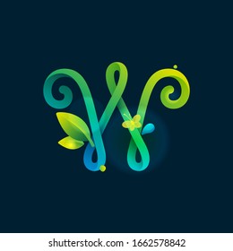 W letter eco logo with green curved lines, leaves and dew drops. Vector handwritten script font for nature labels, bio company, spring posters etc.