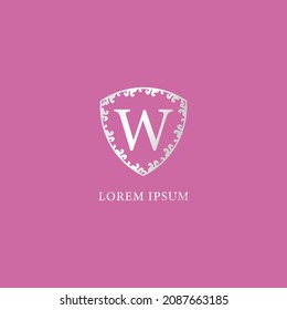 W Letter Intial logo design template. Luxury silver decorative floral shield illustration. Suitable for Insurance, fashion and beauty product. Isolated on pink color background.