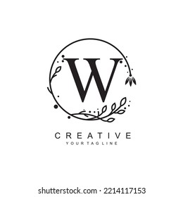 
W letter logo design with floral frame ornaments and circular leaves. the letter W design is beautiful and luxurious. W monogram typography. suitable for beauty, business, company, promotion logo etc