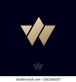 W monogram. W monogram on a black backgrounds. Abstract golden emblem