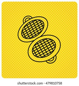 Waffle iron icon. Kitchen baking tool sign. Linear icon on orange background. Vector