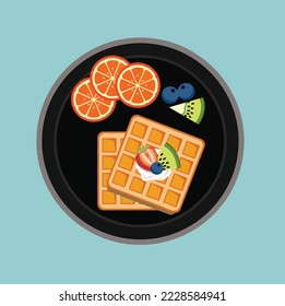 Waffle with topping strawberry, kiwi, blueberry, orange and cream for your breakfast