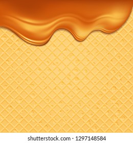 Waffles on which the glossy stream of caramel flows.