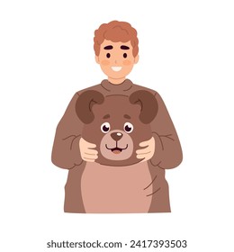 Waist-up portrait of a man in a cute bear costume, holding the costumes head in his hands.