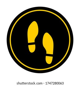 Wait Here or Stand Here Round Floor Marking Sticker Icon with Text and Shoeprints for Queue Line or Other Purposes Requiring Social Distancing. Vector Image.