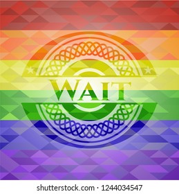 Wait on mosaic background with the colors of the LGBT flag