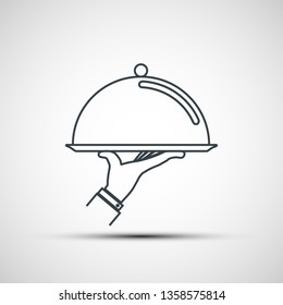 Waiter holding empty tray with a cloche. Logo design. Vector icon.