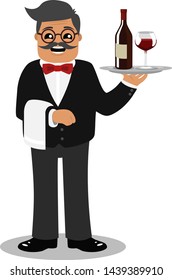 A waiter stands holding a bottle of wine and wine glass on a tray.