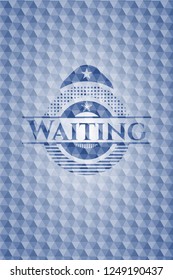 Waiting blue badge with geometric pattern background.