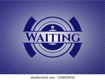 Waiting emblem with jean background