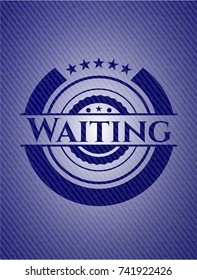 Waiting emblem with jean background